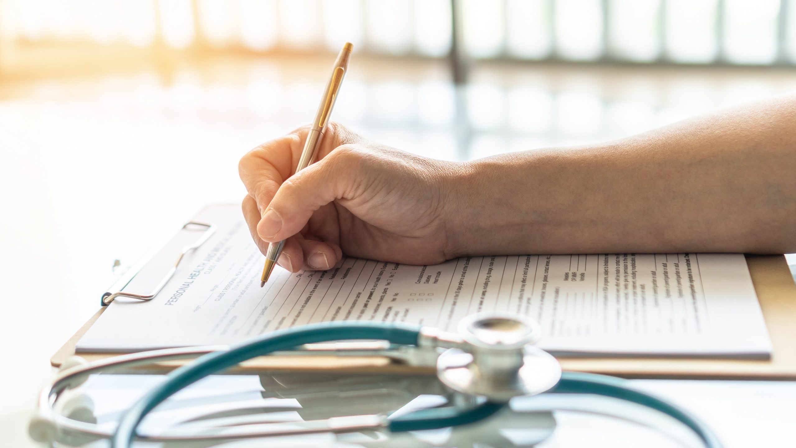 Testimonials 1 man completes paperwork to pay for drug rehab